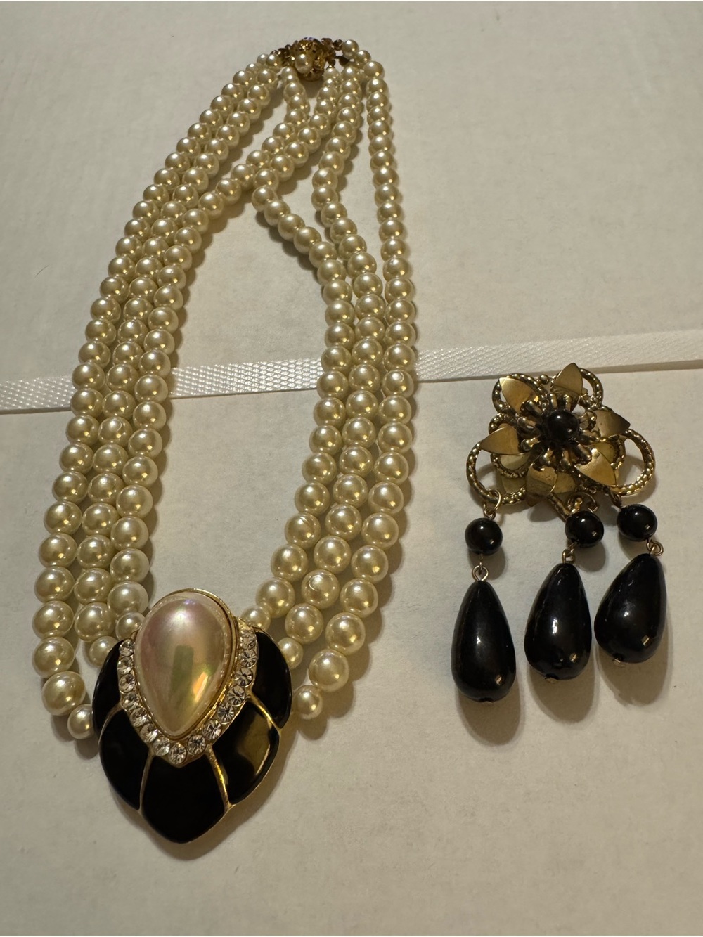 Ivory Pearl Multi-Strand Necklace with Black and Gold Pendant
